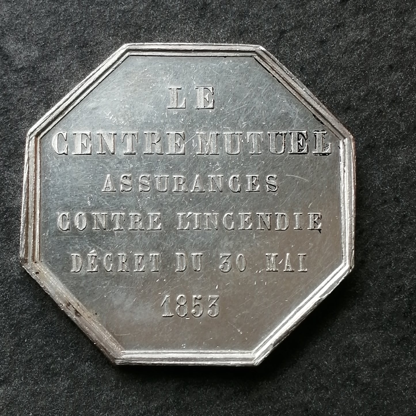 Ficha de seguro El centro mutuo contra el fuego 30 de mayo de 1853 Plata 19.09gr 36mm